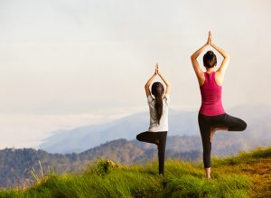girl and adult female yoga