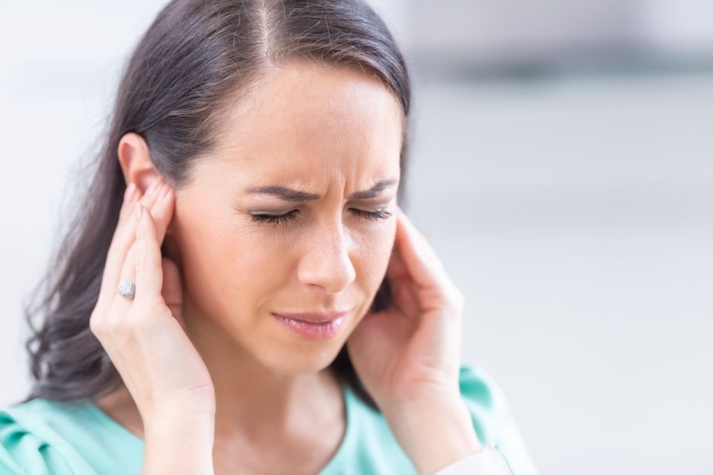 Young woman have headache migraine