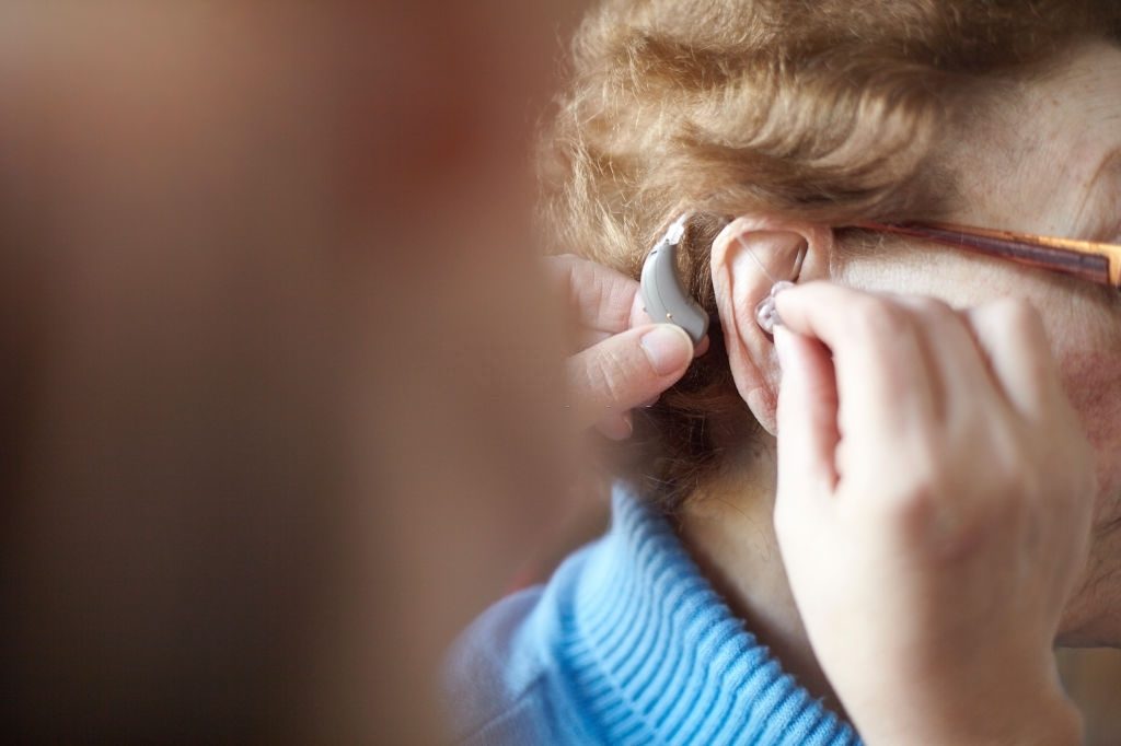 a female senior citizen wearing hearing ads