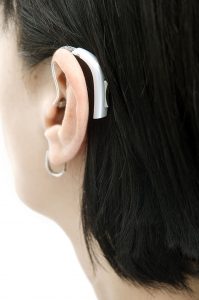 hearing aid at left ear