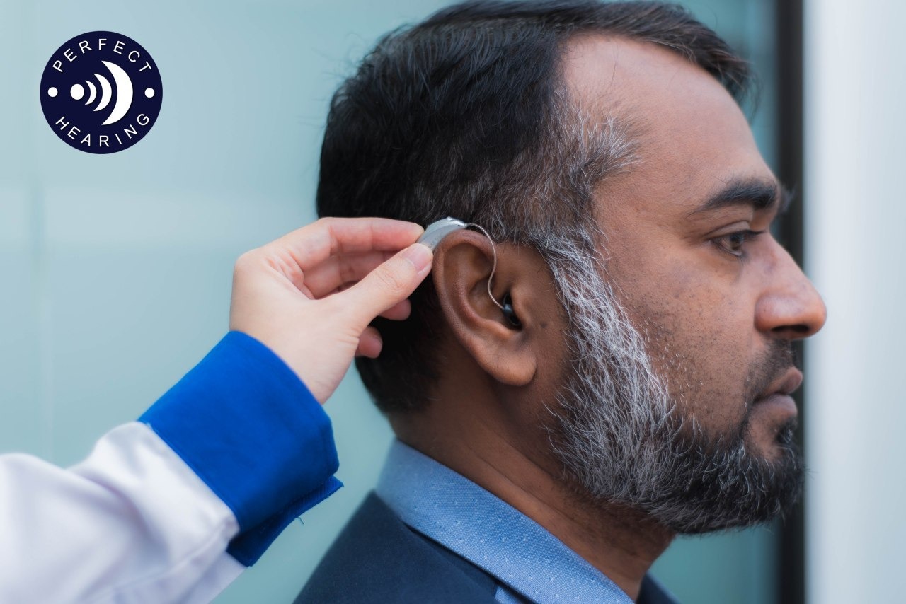 an audiologist perform hearing test to a patient in Perfect Hearing centre